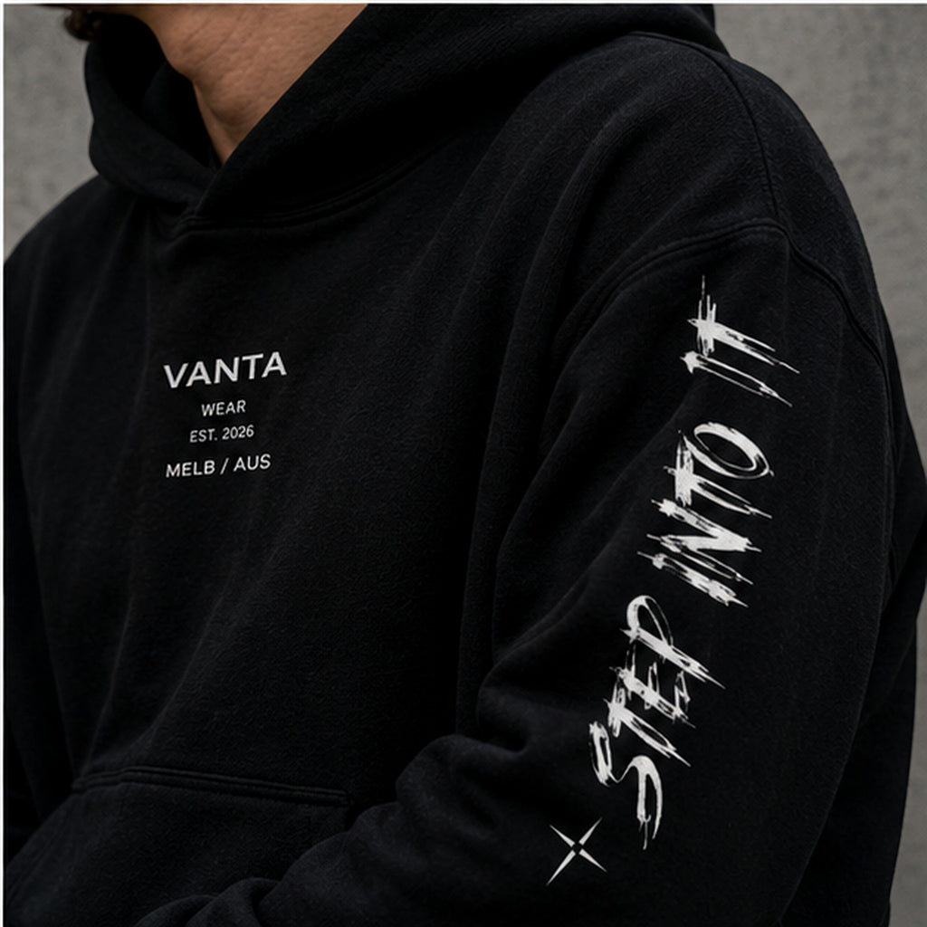 Vanta heavyweight black fleece hoodie with white graffiti sleeve print and chest logo, oversized streetwear fit.