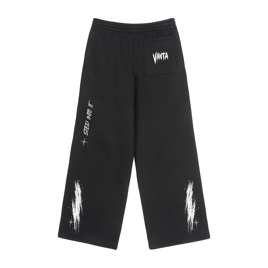 Vanta black unisex fleece sweatpants with white graffiti-style print, oversized fit, and drawstring waist.