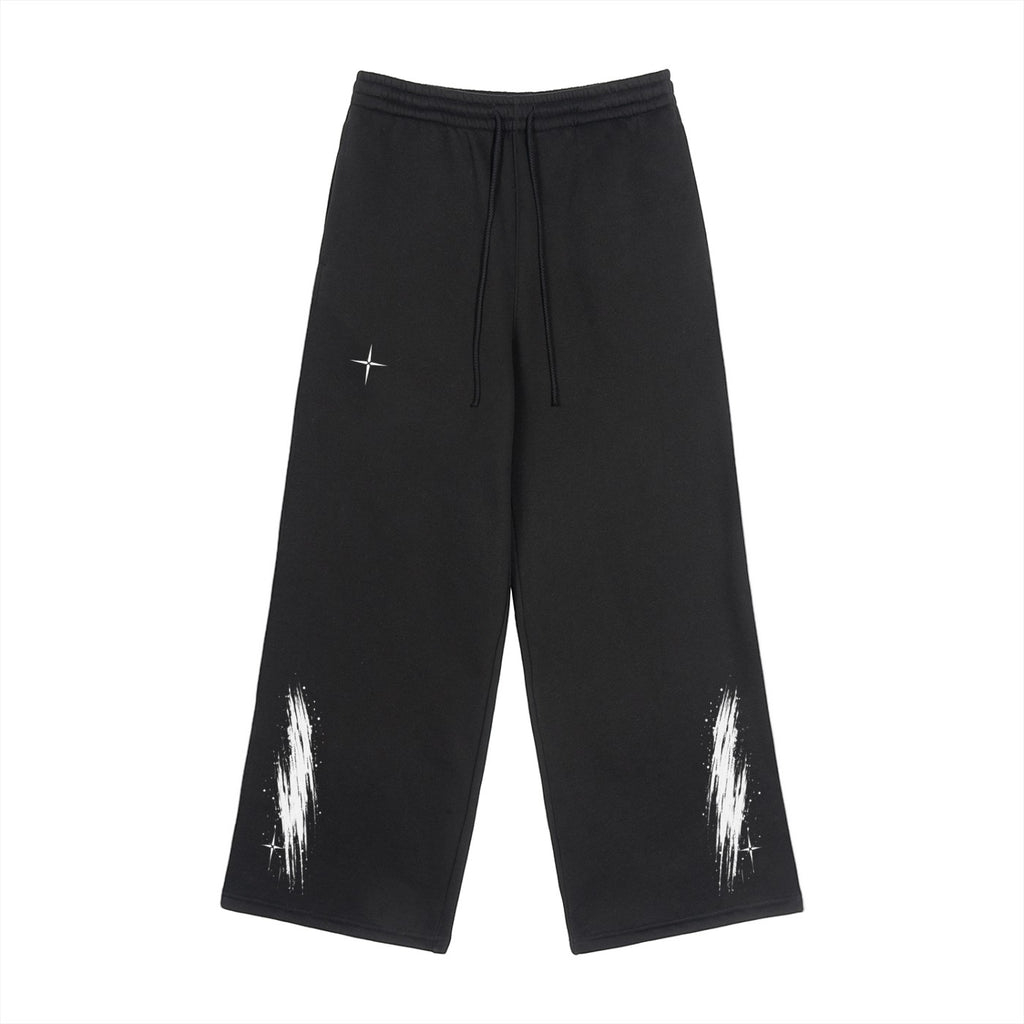 Vanta unisex black fleece sweatpants with white graffiti-inspired brushstroke prints and small star details.